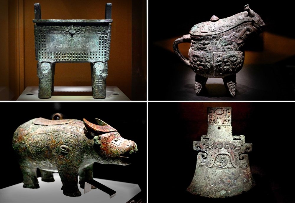 這是殷墟博物館新館內(nèi)展出的“司母辛”銅鼎（左上）、“亞長”銅?。ㄓ疑希?、“亞長”牛尊（左下）、“亞長”銅鉞（拼版照片，2月23日攝）。
